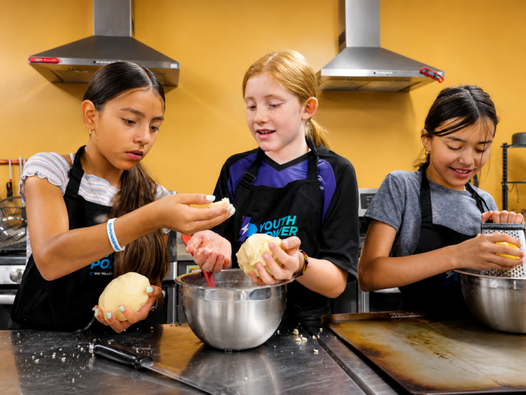 Middle school girls baking during Youth Power's Culinary Program in Eagle County Colorado