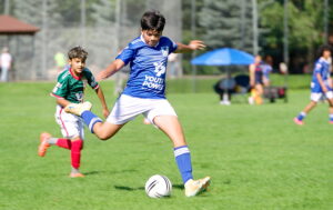 Two boys playing middle school soccer with Youth Power in Eagle County, Colorado